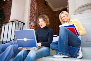group sitting with computers
